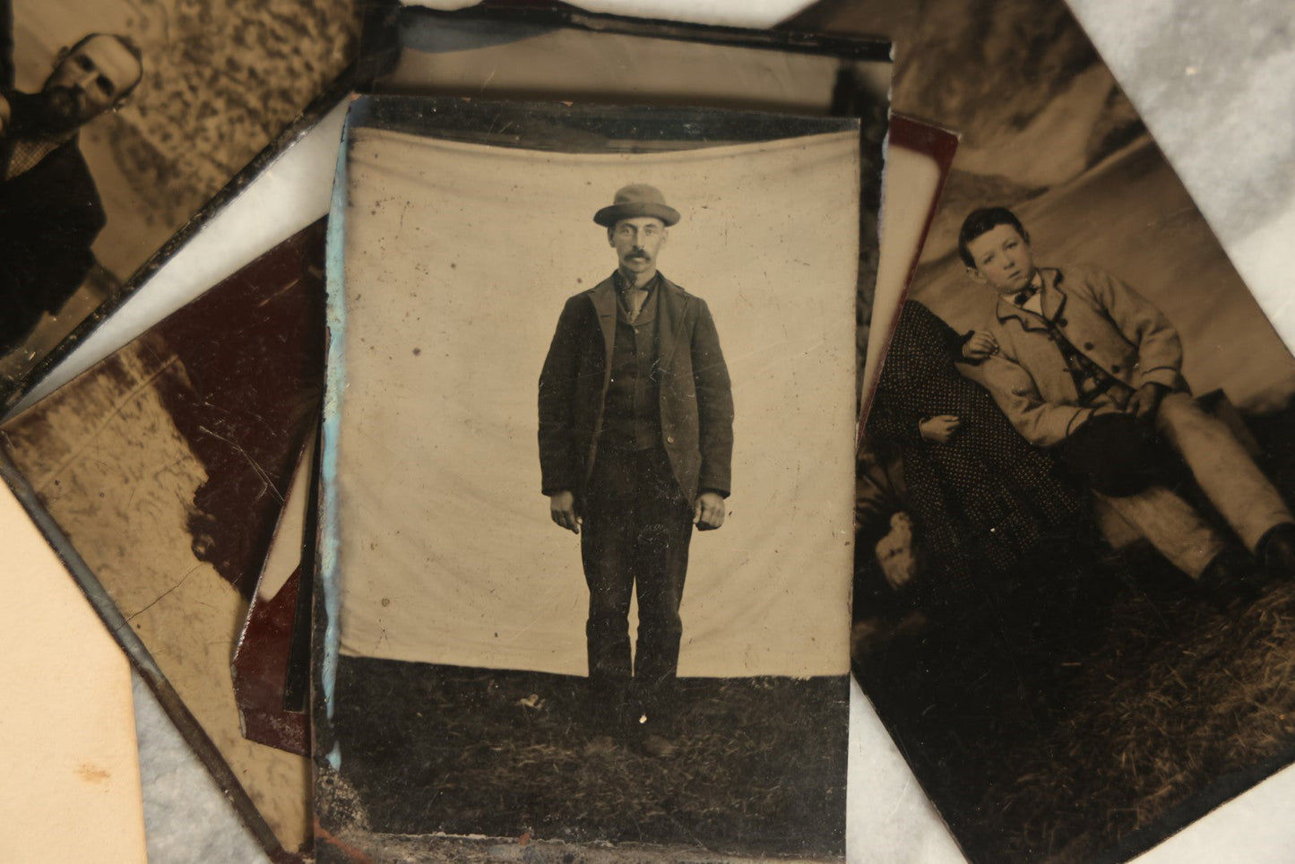 Lot 092 - Grouping Of Antique Tintype Portrait Photographs Of Men, Women, And Children, Including Some With Multiple People, Varying Conditions