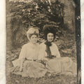 Lot 095 - Single Antique Tintype Photograph, Two Women Outdoors, Sitting On Grass, Smiling