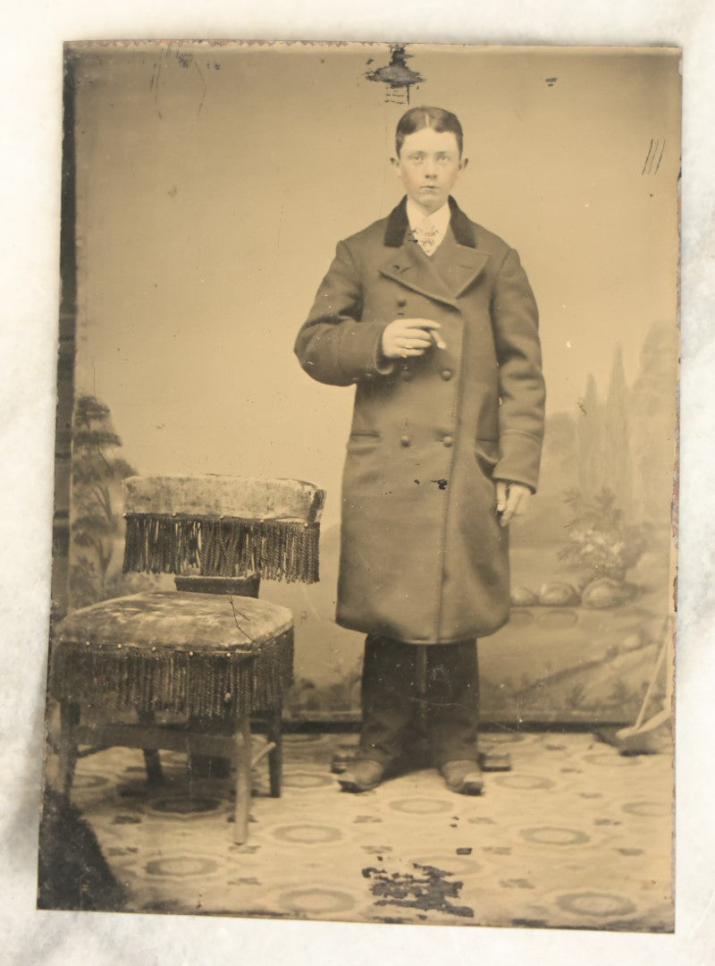 Lot 097 - Single Antique Tintype Photograph, Young Boy Smoking Cigar, In Long Coat