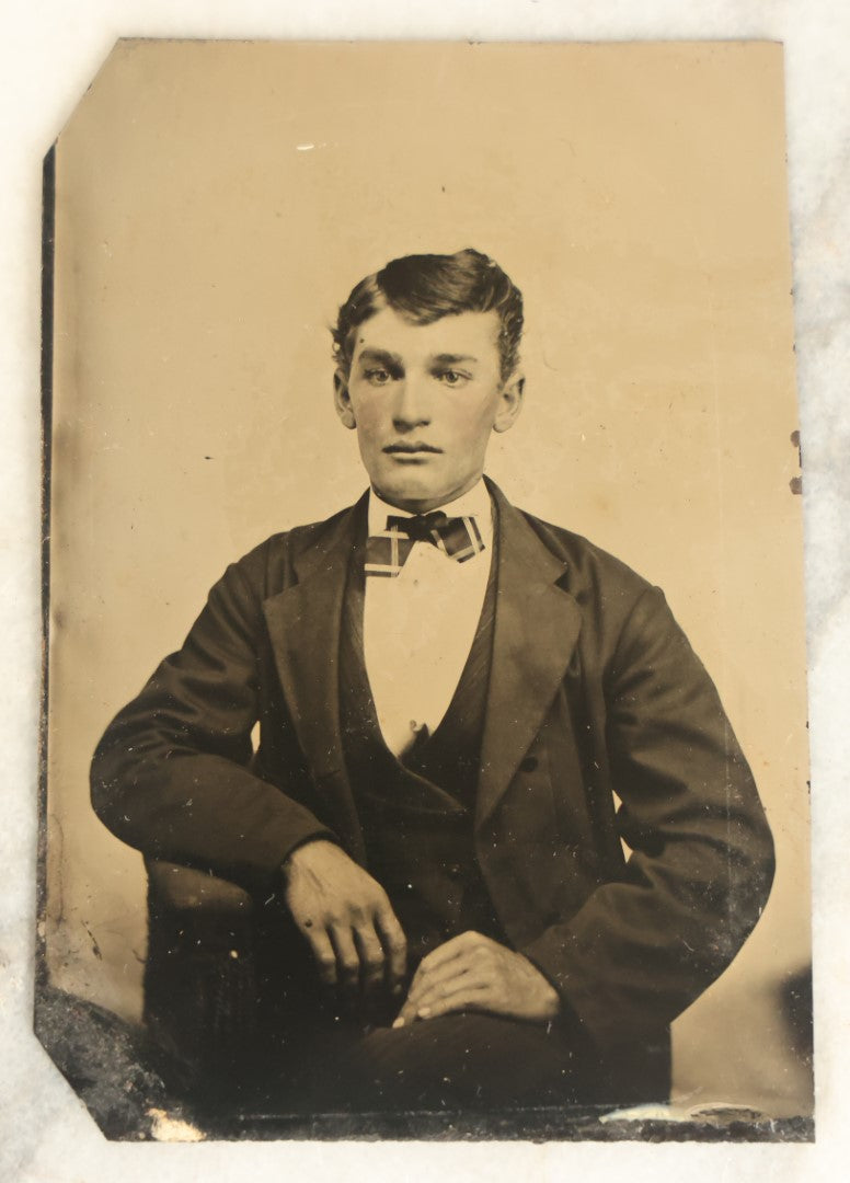 Lot 098 - Single Antique Tintype Photograph, Young Man With A Very Distinctive Face With Defined Bone Structure, Bowtie