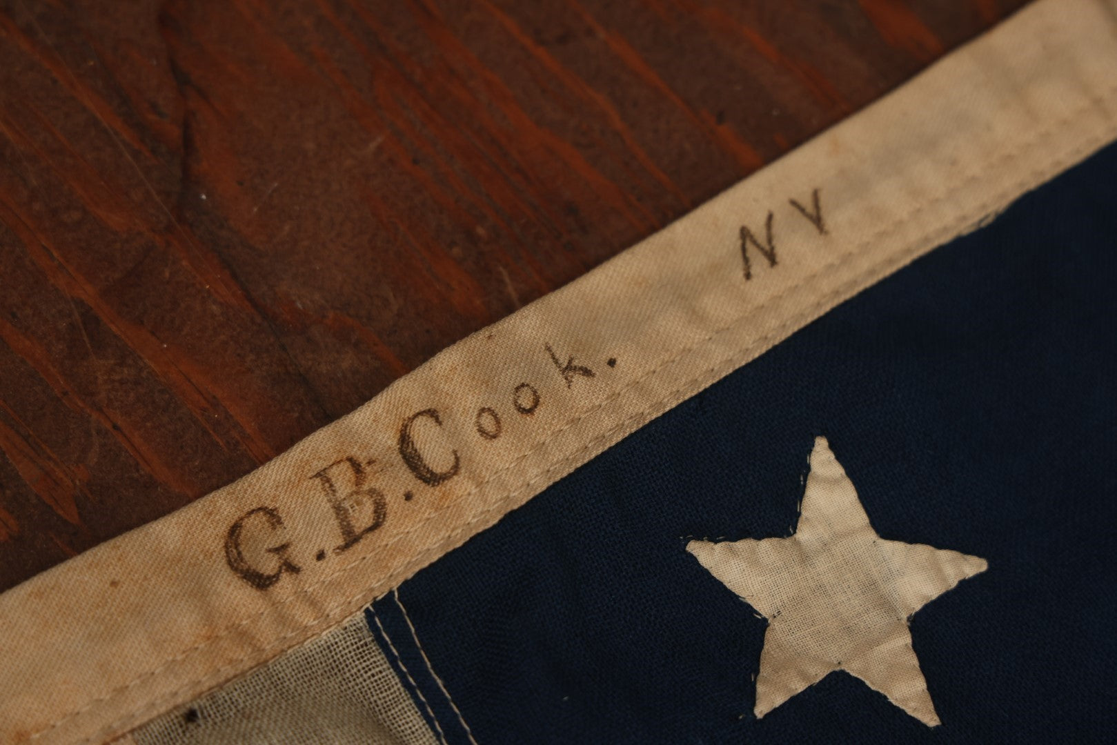 Lot 013 - Antique Hand Sewn United States Thirteen Star Flag, Circa Late 19th Century, Signed G.B. Cook., Note Various Holes And Wear 