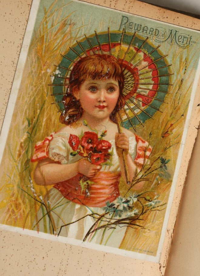 Lot 029 - Antique Victorian Trade Card Scrapbook Album With Two Girls And Puppy On Cover, Containing Many Scraps Including Rat Poison, Calling Card, Frogs, And More