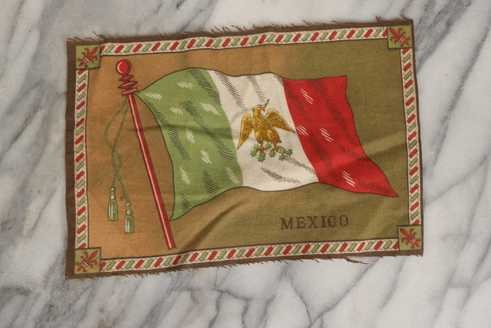 Lot 039 - Grouping Of Ten Antique Tobacco Felt Flags, Including Japan, 2 x Russia, Italy, Mexico, Cuba, Belgium, Netherlands, Austria-Hungary, And The Union Jack, Various Wear.