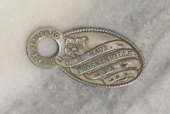 Lot 041 - Antique Hotel Key Tag With Dog, C.M. Haus, Phoenixville, Pennsylvania