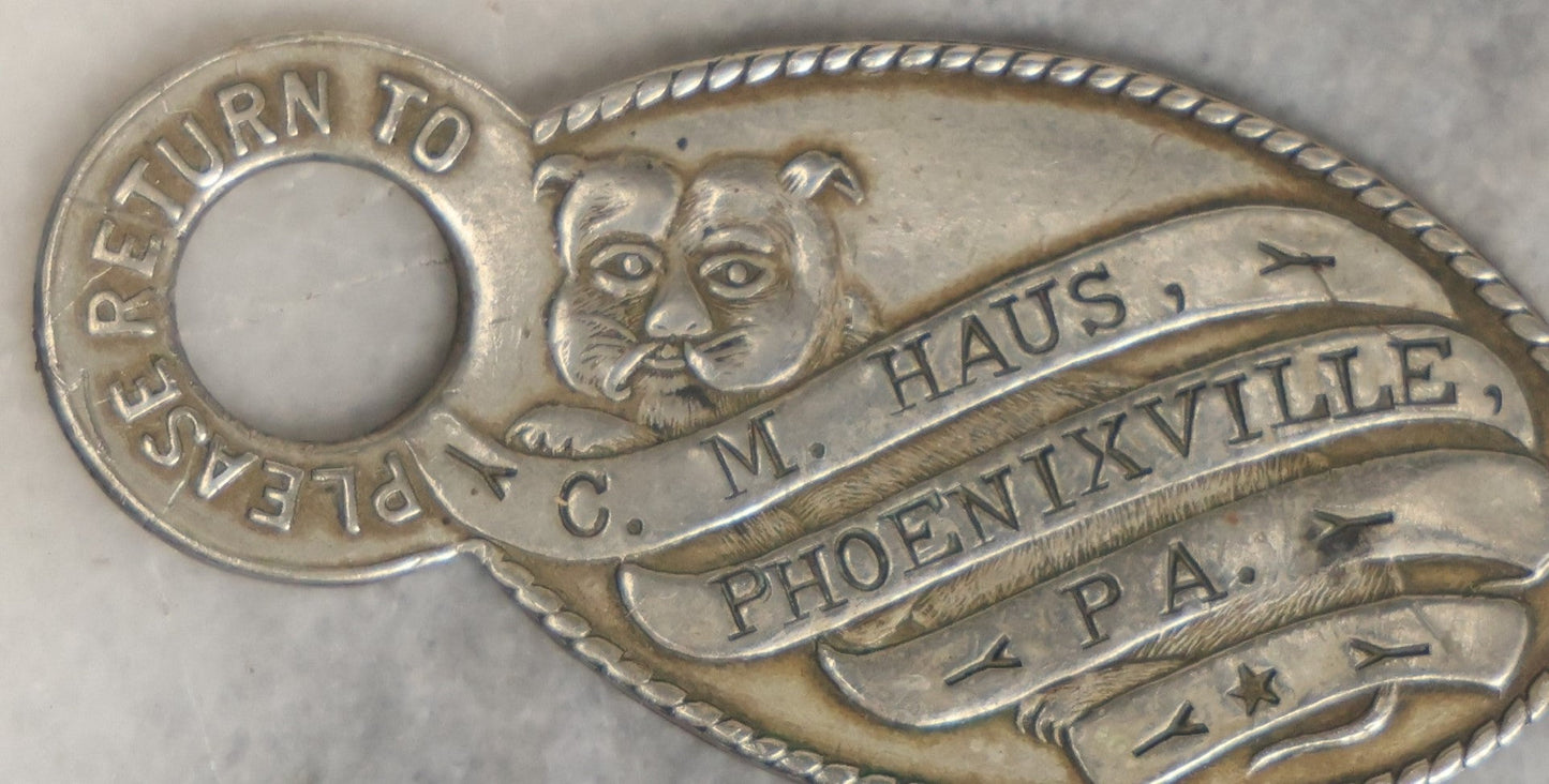 Lot 041 - Antique Hotel Key Tag With Dog, C.M. Haus, Phoenixville, Pennsylvania