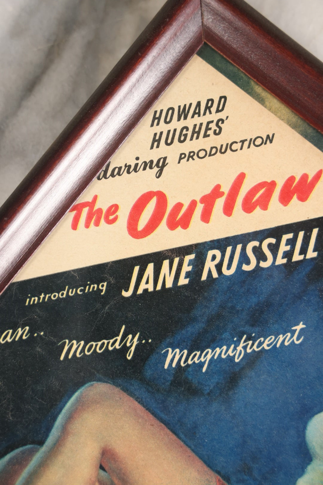 Lot 049 - Vintage Framed Movie Advertisement For Howard Hughes' "The Outlaw" Introducing Jane Russell, Pinup