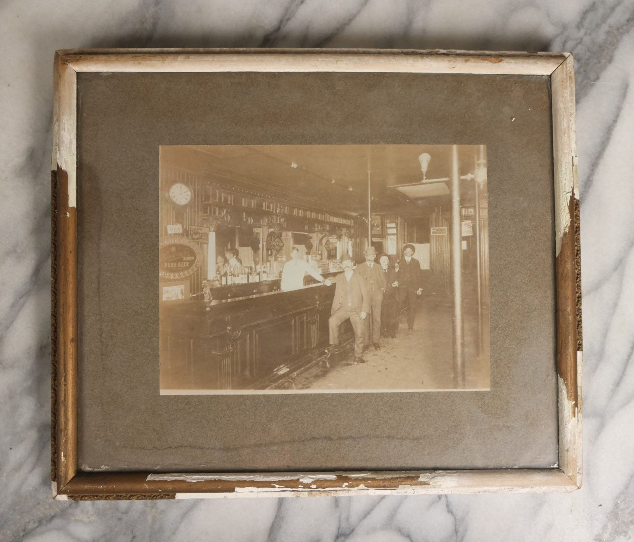 Lot 050 - Antique Framed Boarded Photograph Of A Bar Room, Four Men At The Bar With Barkeeper, Beer Advertisements, Etc