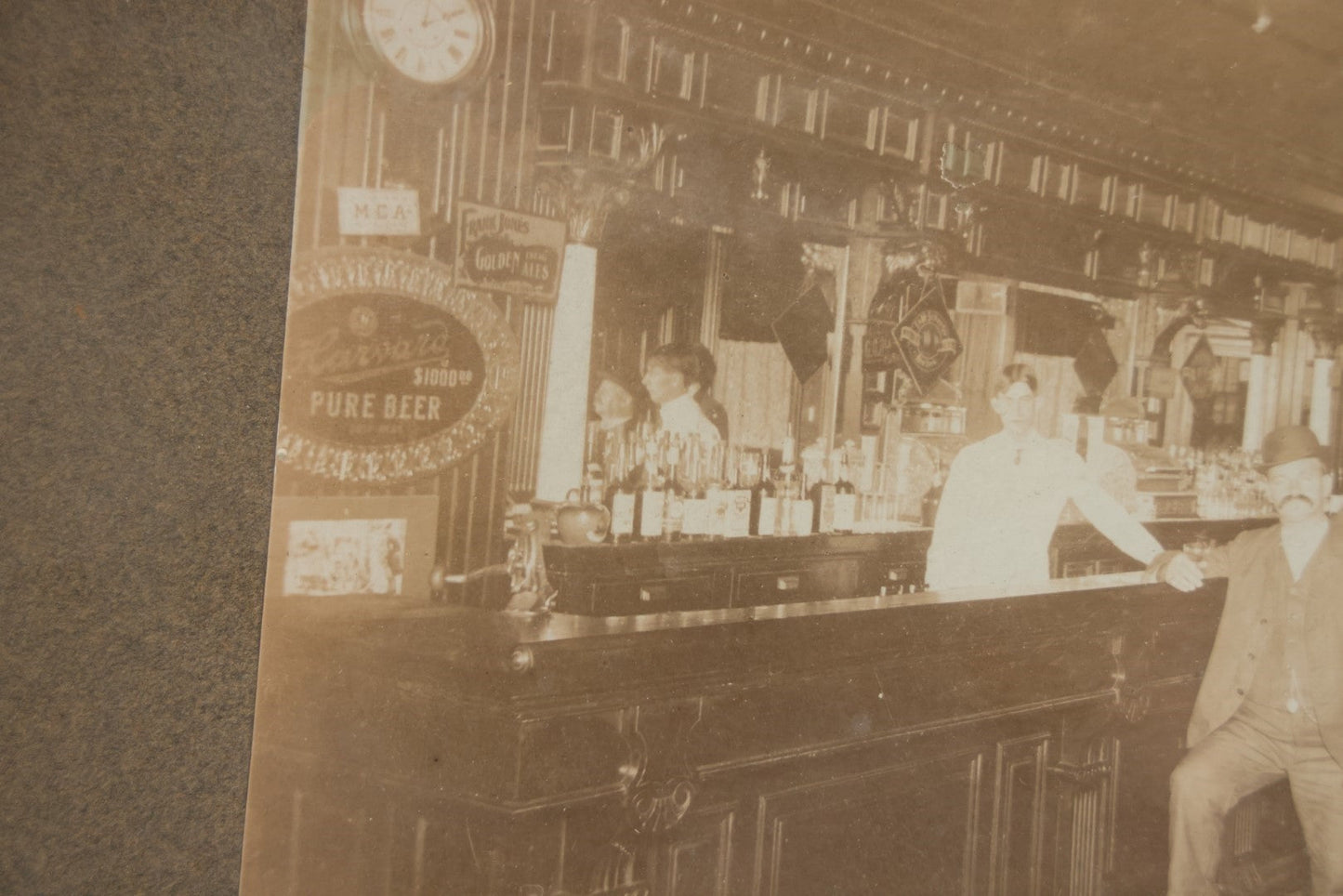 Lot 050 - Antique Framed Boarded Photograph Of A Bar Room, Four Men At The Bar With Barkeeper, Beer Advertisements, Etc