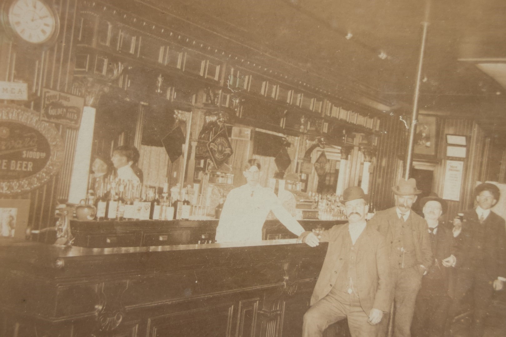 Lot 050 - Antique Framed Boarded Photograph Of A Bar Room, Four Men At The Bar With Barkeeper, Beer Advertisements, Etc