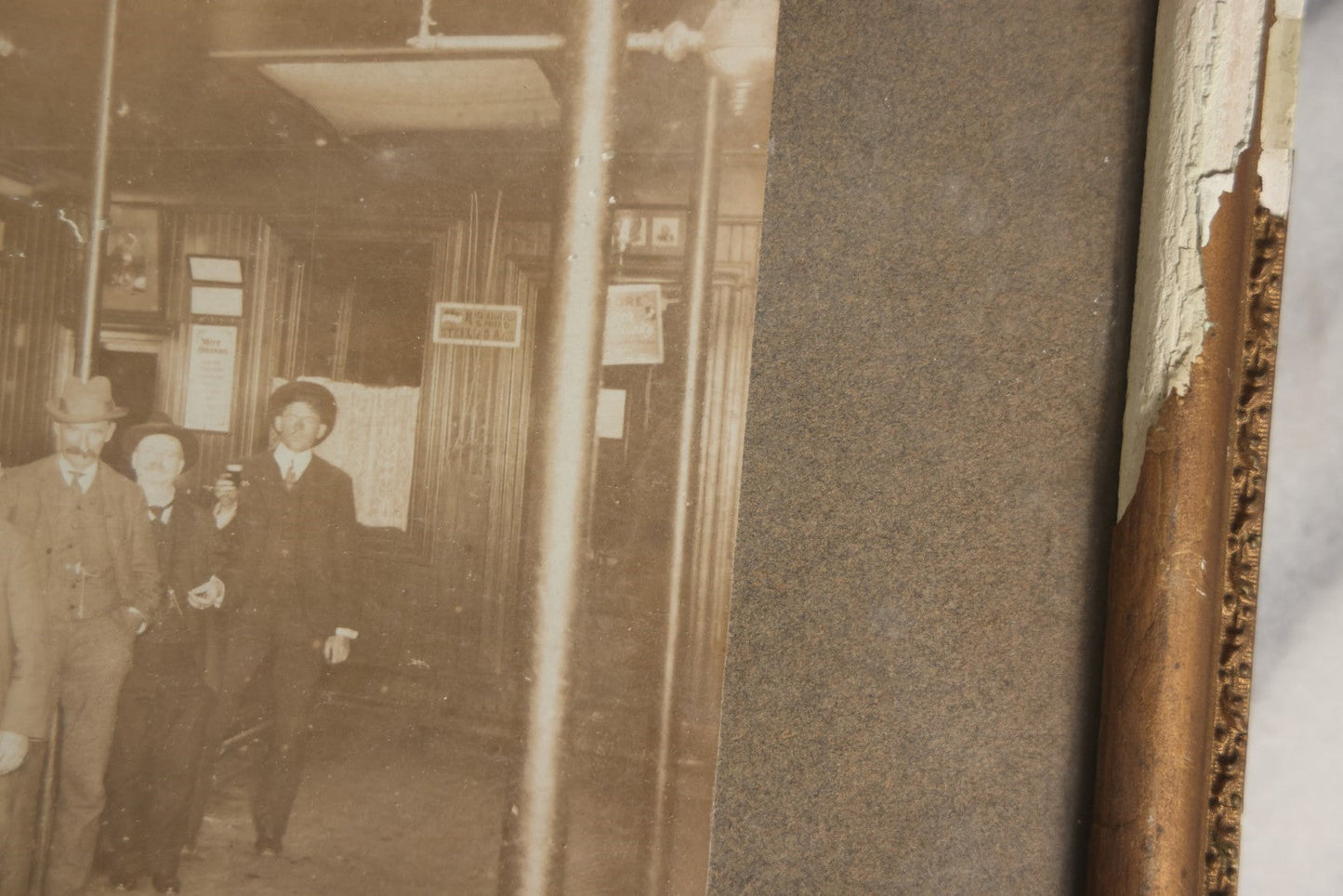 Lot 050 - Antique Framed Boarded Photograph Of A Bar Room, Four Men At The Bar With Barkeeper, Beer Advertisements, Etc