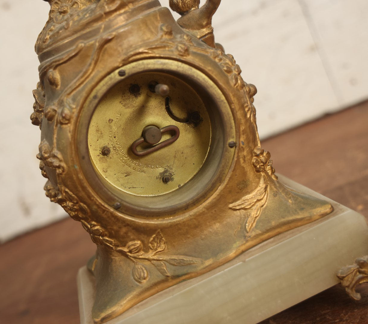 Lot 008 - Antique Decorative Clock With Cast Metal Cupid Figural Statue, By The Jennings Brothers, Bridgeport, Connecticut, Not Functioning