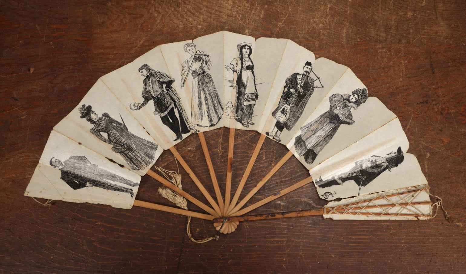 Lot 009 - Antique Varnished Paper Hand Fan With Original Pen And Ink Illustrations Of Many Characters, Actor With Skull, Woman With Dogs, Horse Riders, And More, Two Artist Signatures, Dated 1900