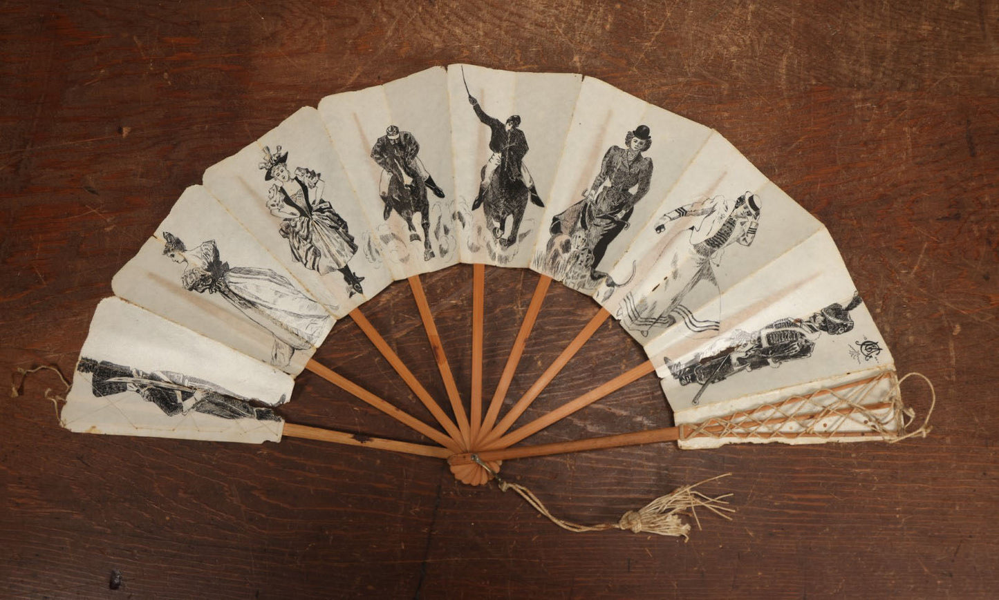 Lot 009 - Antique Varnished Paper Hand Fan With Original Pen And Ink Illustrations Of Many Characters, Actor With Skull, Woman With Dogs, Horse Riders, And More, Two Artist Signatures, Dated 1900