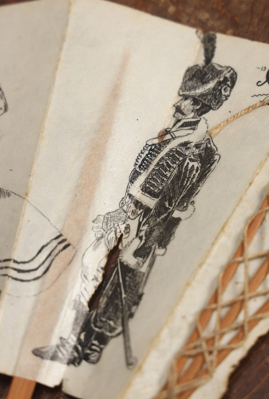 Lot 009 - Antique Varnished Paper Hand Fan With Original Pen And Ink Illustrations Of Many Characters, Actor With Skull, Woman With Dogs, Horse Riders, And More, Two Artist Signatures, Dated 1900