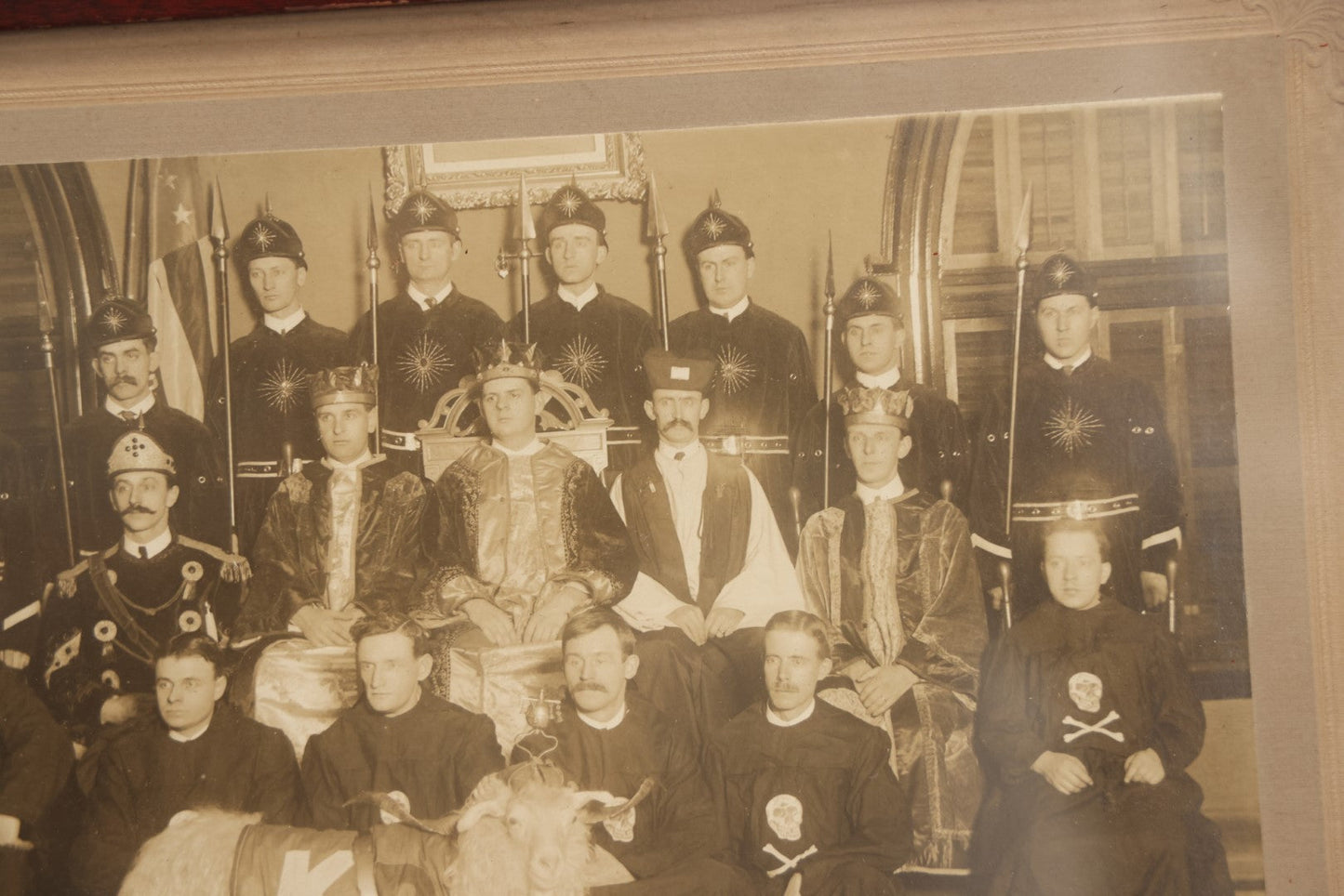 Lot 020 - Antique Boarded Group Photo, Fraternal Gathering, Likely Knights Of Pythias, With Goat And Skull And Crossbones Scene Bearers Robes, In Frame, 11-1/4" x 9-1/4"