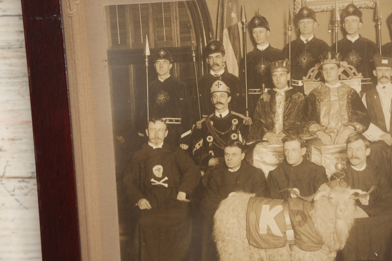 Lot 020 - Antique Boarded Group Photo, Fraternal Gathering, Likely Knights Of Pythias, With Goat And Skull And Crossbones Scene Bearers Robes, In Frame, 11-1/4" x 9-1/4"