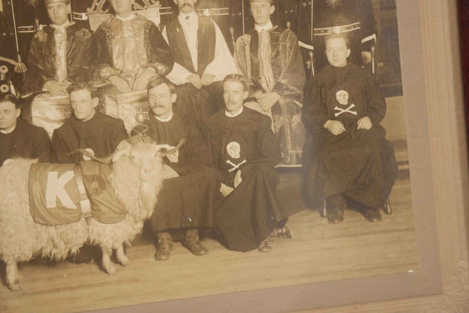 Lot 020 - Antique Boarded Group Photo, Fraternal Gathering, Likely Knights Of Pythias, With Goat And Skull And Crossbones Scene Bearers Robes, In Frame, 11-1/4" x 9-1/4"