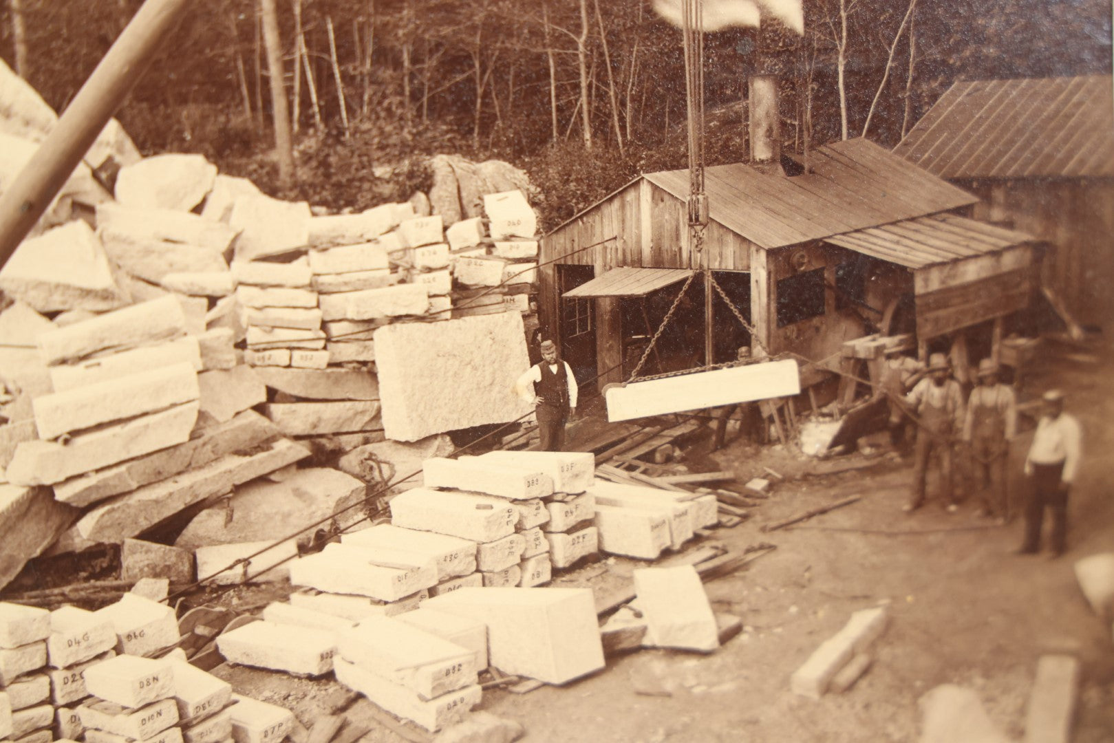 Lot 021 - Antique Occupational Photo Of A Group Of Quarrymen And Apparatus At A Quarry In Milford, Massachusetts, With Handwritten Inscription, 14-3/4" x 13"