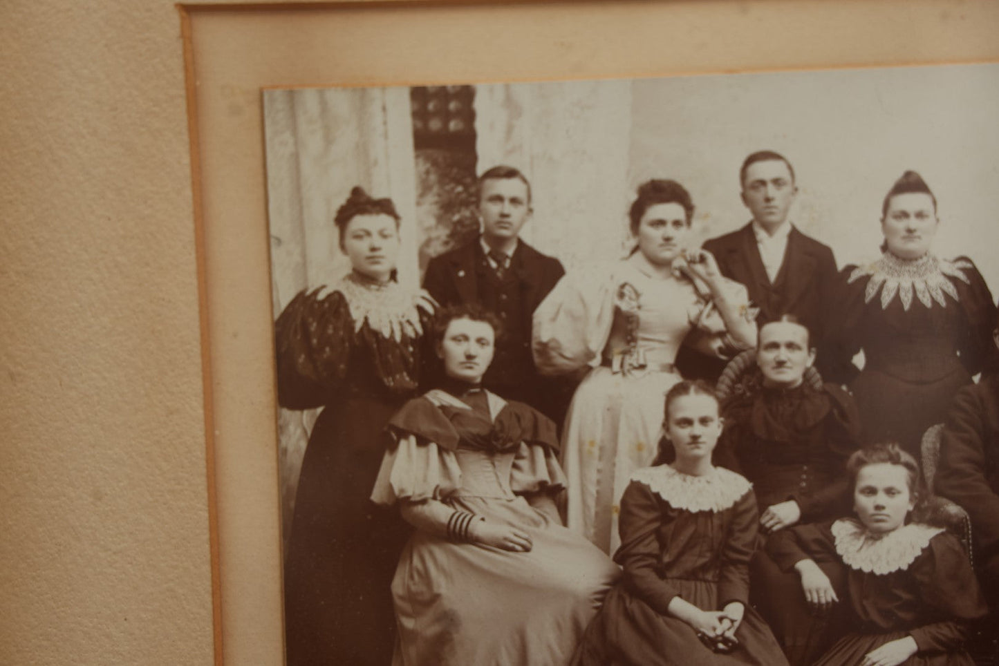 Lot 031 - Antique Late 19th Century Group Photo Of Well Dressed People, Four Men, Eight Women, Boarded And Framed, Note Water Damage To Mat