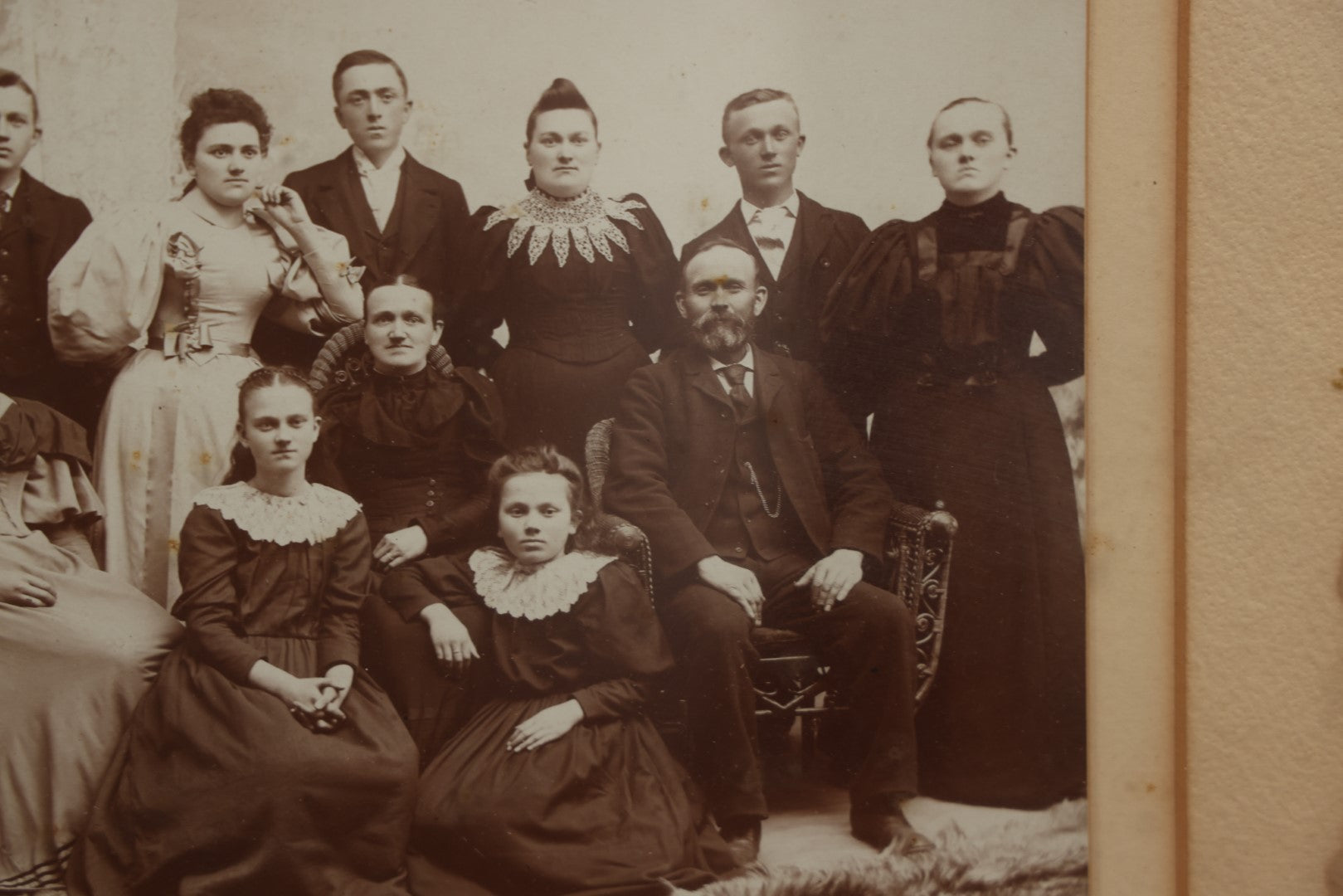 Lot 031 - Antique Late 19th Century Group Photo Of Well Dressed People, Four Men, Eight Women, Boarded And Framed, Note Water Damage To Mat