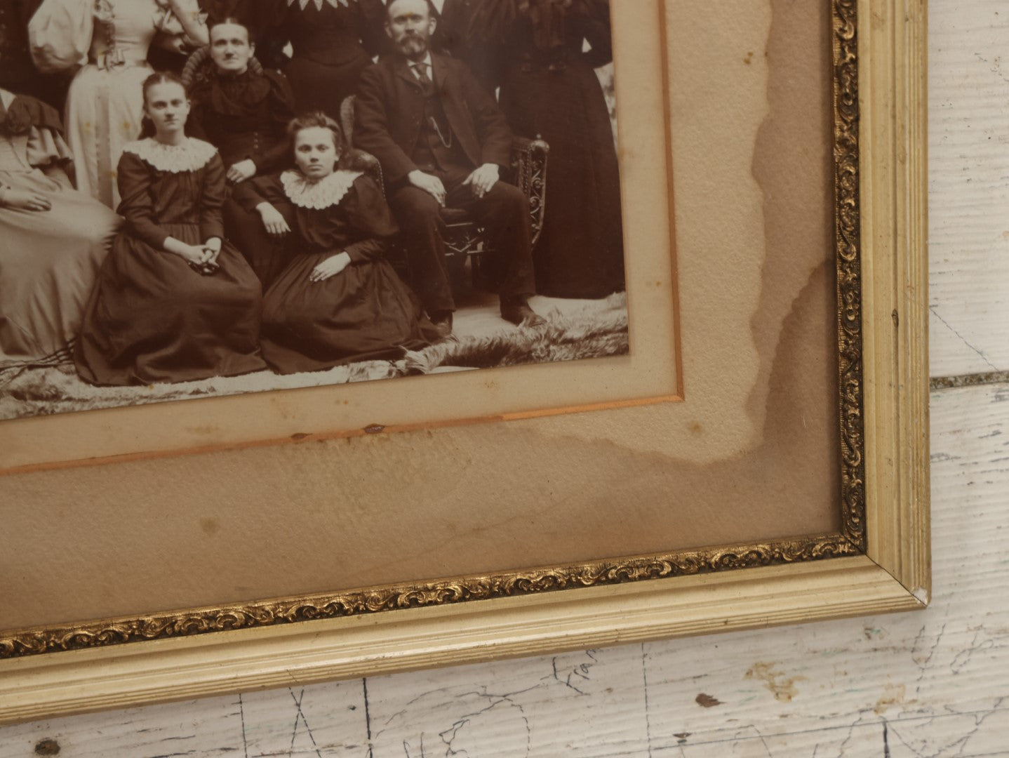 Lot 031 - Antique Late 19th Century Group Photo Of Well Dressed People, Four Men, Eight Women, Boarded And Framed, Note Water Damage To Mat