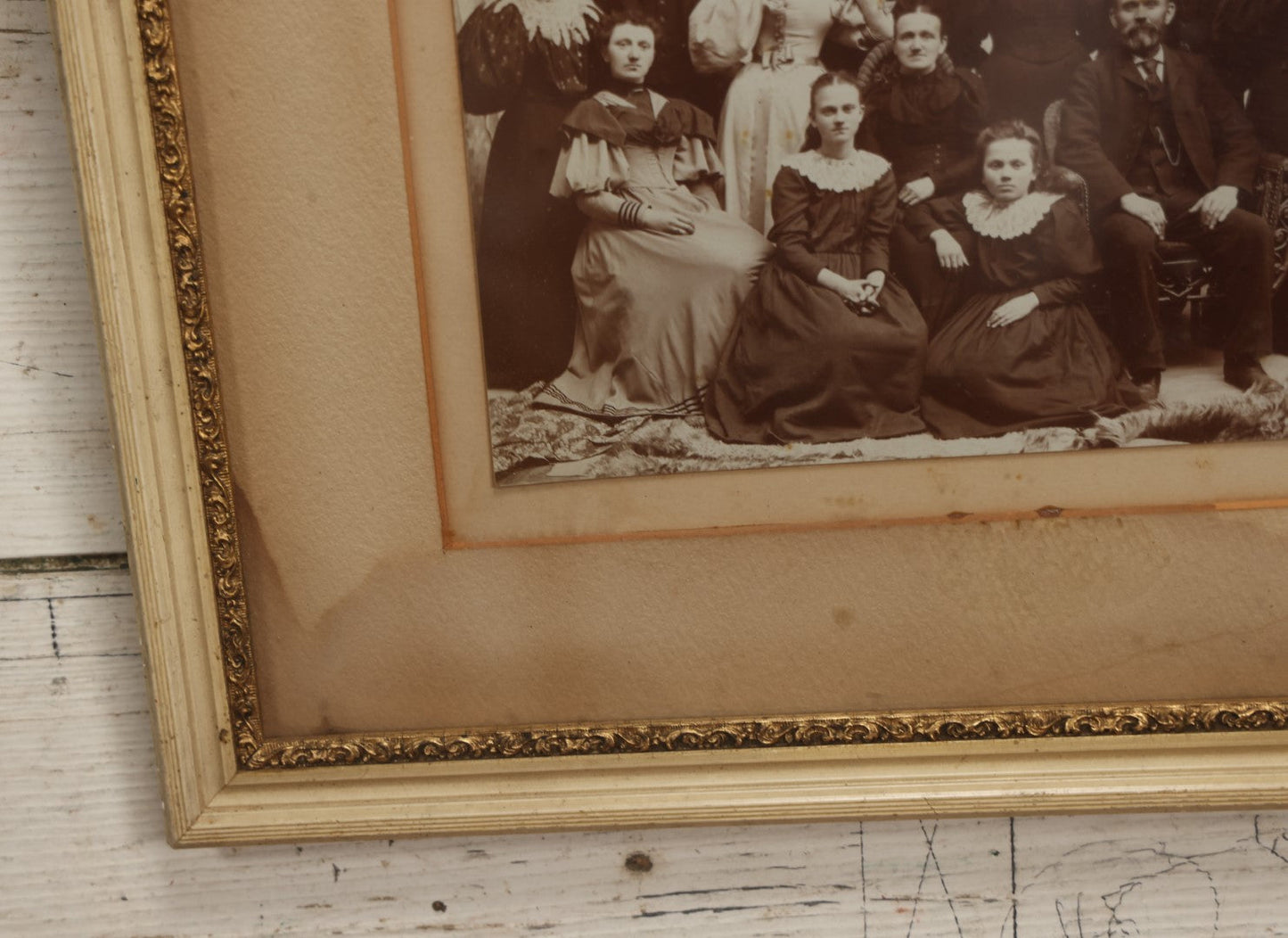 Lot 031 - Antique Late 19th Century Group Photo Of Well Dressed People, Four Men, Eight Women, Boarded And Framed, Note Water Damage To Mat