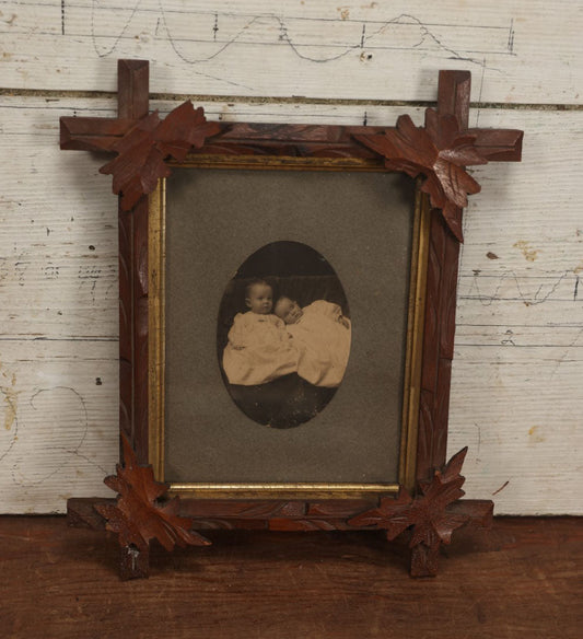 Lot 036 - Antique Boarded Oval Photo Of Two Babies, Likely Twins, In A Carved Oak Leaf Frame