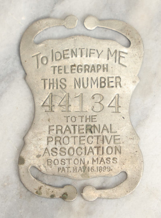 Lot 040 - Antique Fraternal Protective Association Identity Belt Tag, Boston, Massachusetts, 1899, With Number To Telegraph In Case Of Emergency