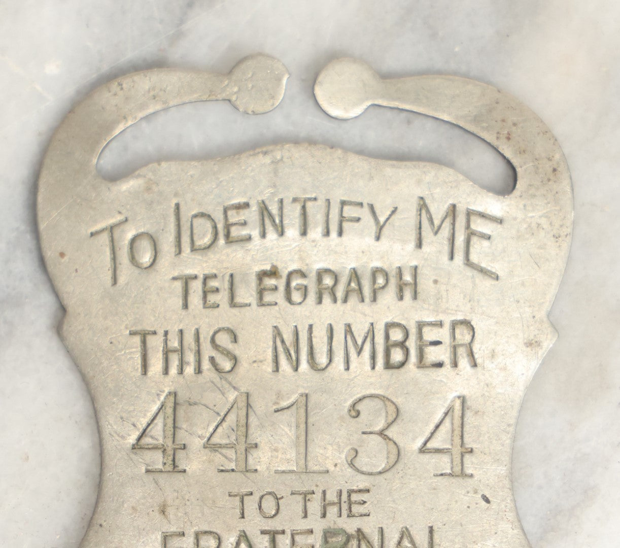 Lot 040 - Antique Fraternal Protective Association Identity Belt Tag, Boston, Massachusetts, 1899, With Number To Telegraph In Case Of Emergency