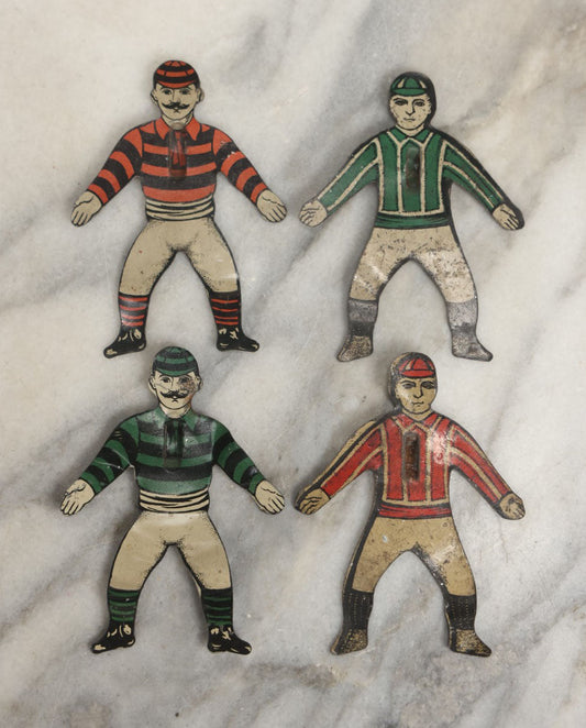 Lot 043 - Grouping Of Four Vintage Tin Lithograph Metal Football Player Game Pieces From Blow Football, Circa 1930