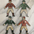Lot 043 - Grouping Of Four Vintage Tin Lithograph Metal Football Player Game Pieces From Blow Football, Circa 1930