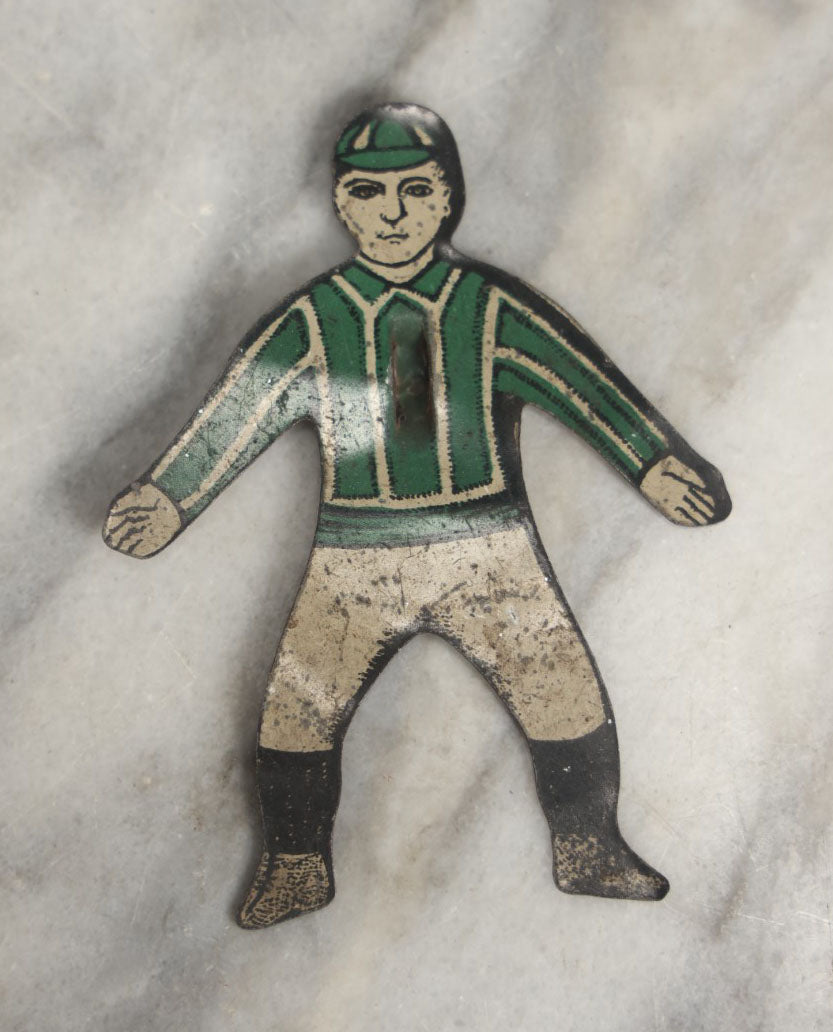 Lot 043 - Grouping Of Four Vintage Tin Lithograph Metal Football Player Game Pieces From Blow Football, Circa 1930