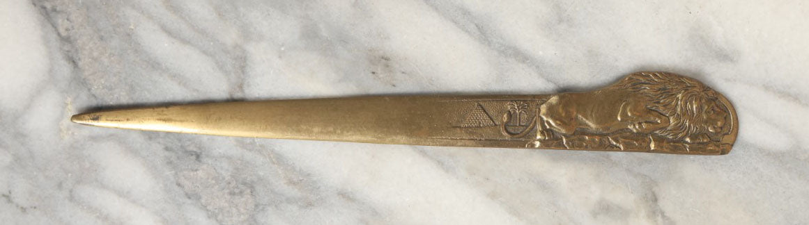 Lot 047 - Vintage Cast Brass Crouching Lion Letter Opener With Pyramid, Palm Tree, Egyptian Revival