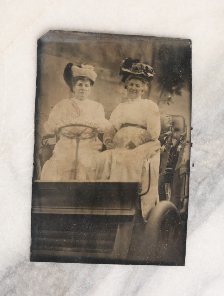 Lot 062 - Grouping Of Five Antique Tintype Photographs Of Men And Women Behind The Wheel Of Early Automobiles, Cars