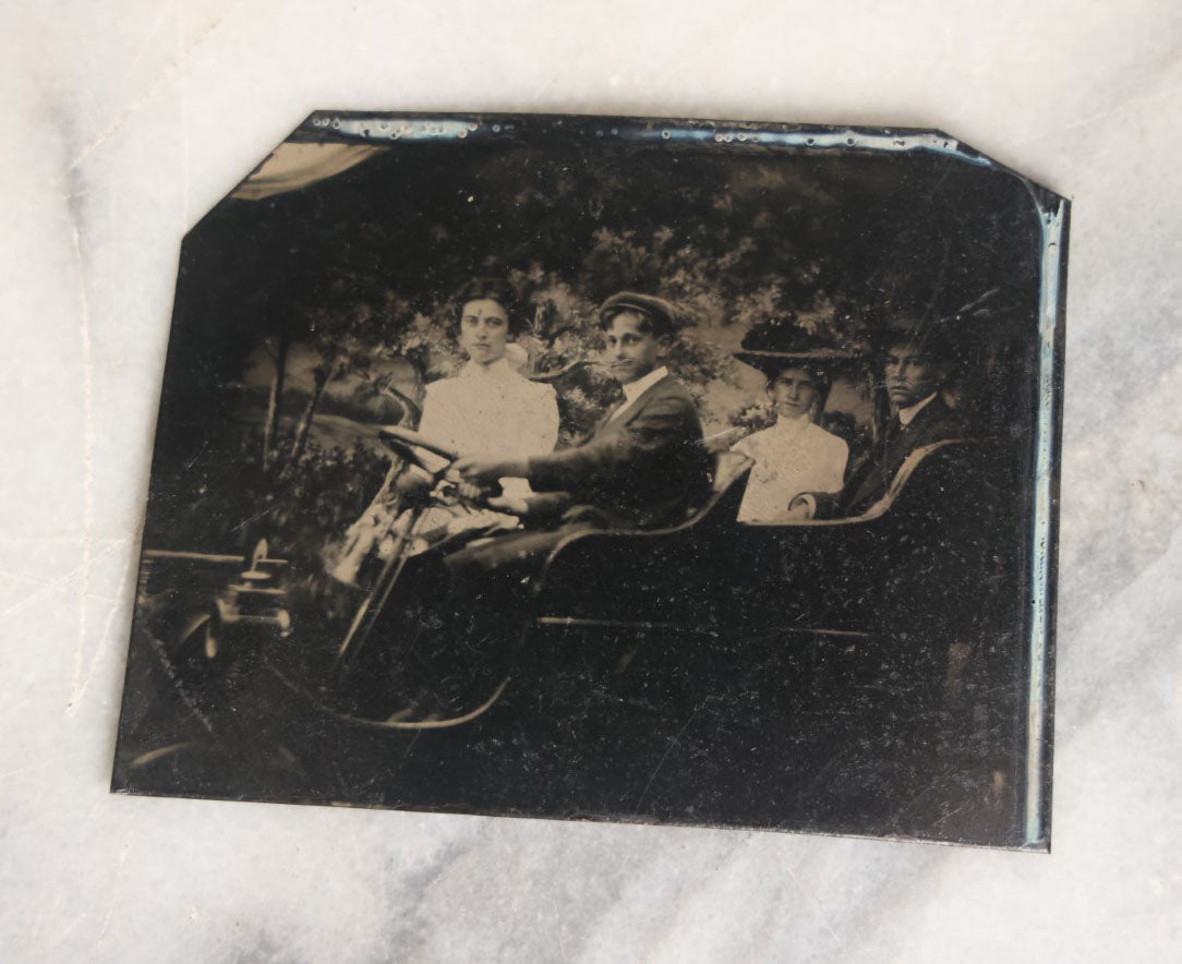 Lot 062 - Grouping Of Five Antique Tintype Photographs Of Men And Women Behind The Wheel Of Early Automobiles, Cars