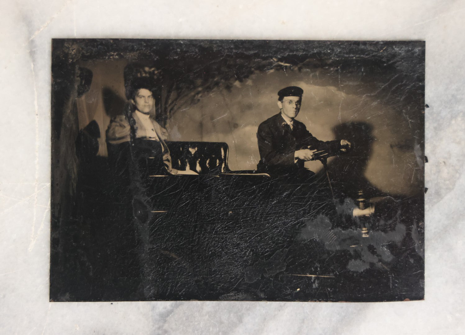 Lot 062 - Grouping Of Five Antique Tintype Photographs Of Men And Women Behind The Wheel Of Early Automobiles, Cars