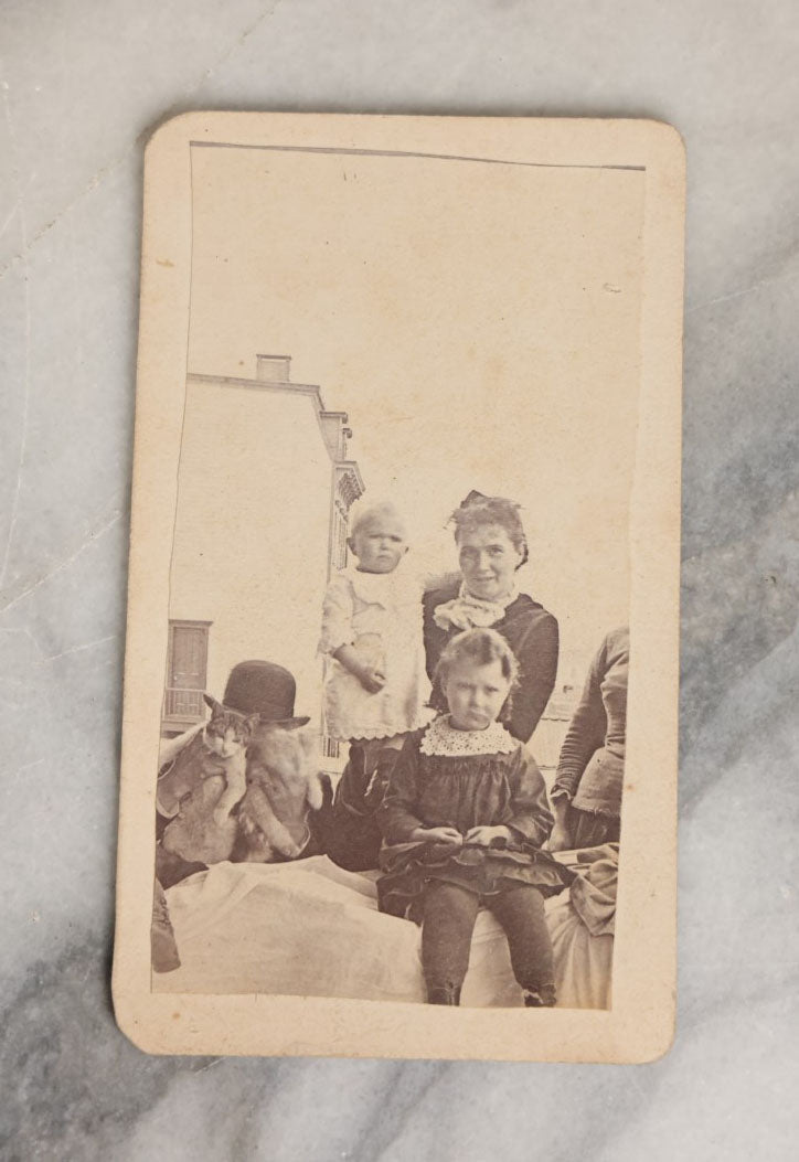 Lot 065 - Single Crudely Cut And Mounted Antique Carte De Visite C.D.V. Photograph Of A Group Of People And A Man Holding Two Cats