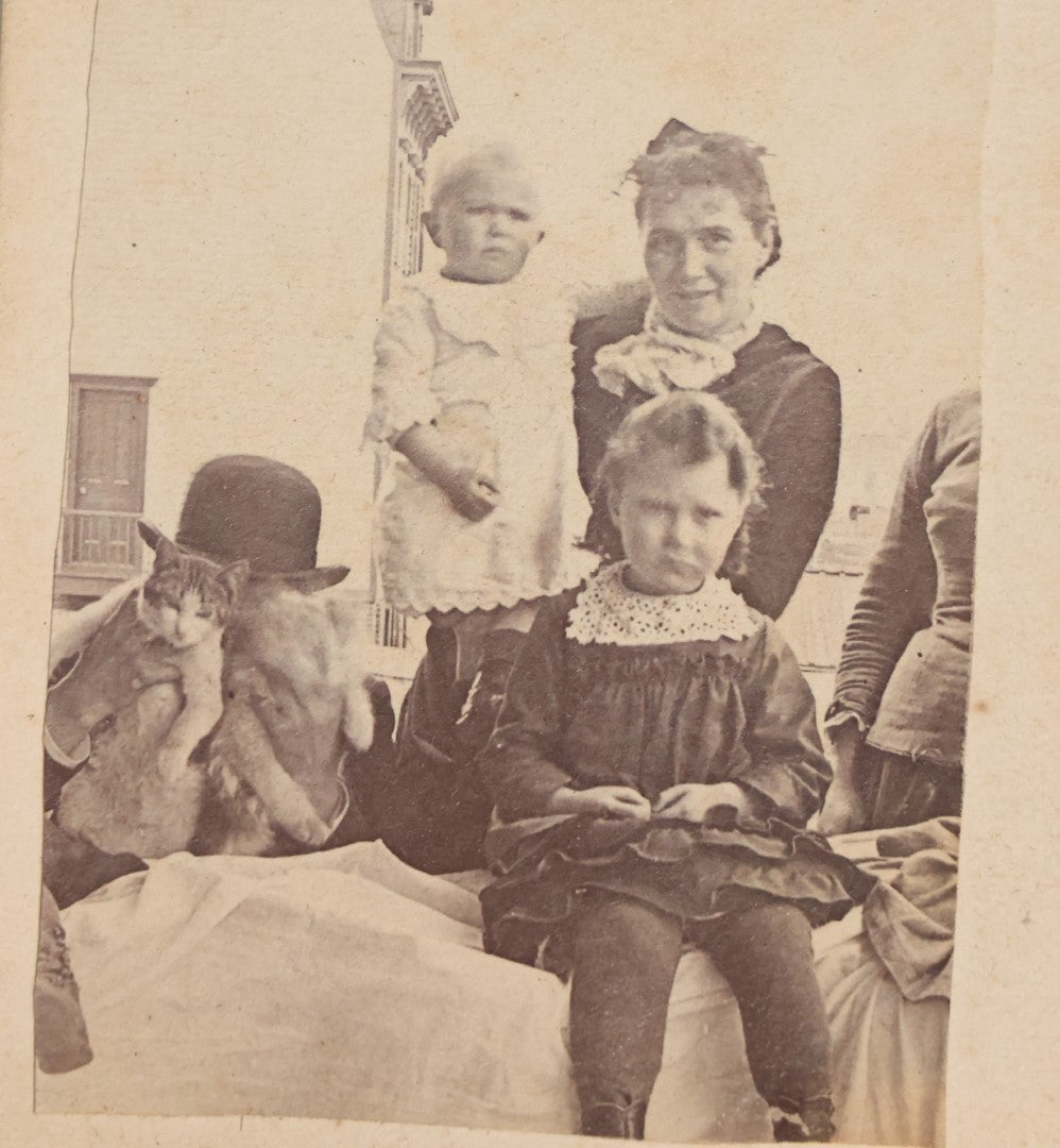 Lot 065 - Single Crudely Cut And Mounted Antique Carte De Visite C.D.V. Photograph Of A Group Of People And A Man Holding Two Cats