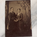 Lot 068 - Single Antique Tintype Photograph Of Two Women Posing Holding Hands, Embracing, With Trees In Back Drop