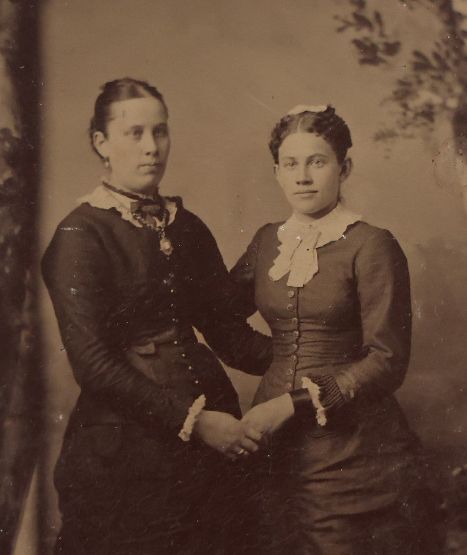 Lot 068 - Single Antique Tintype Photograph Of Two Women Posing Holding Hands, Embracing, With Trees In Back Drop