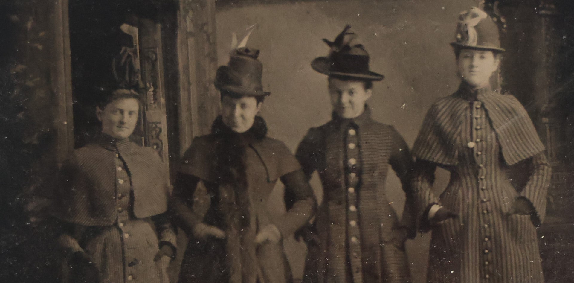 Lot 070 - Single Antique Tintype Photograph Of Four Handsomely Dressed Women In Long Coats, Landscape Orientation, Full Bodies In Shot