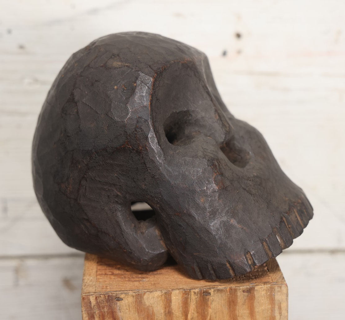 Lot 001 - Antique Folk Art Hand Carved Dark Wooden Skull, 4-1/2" x 6" x 5"