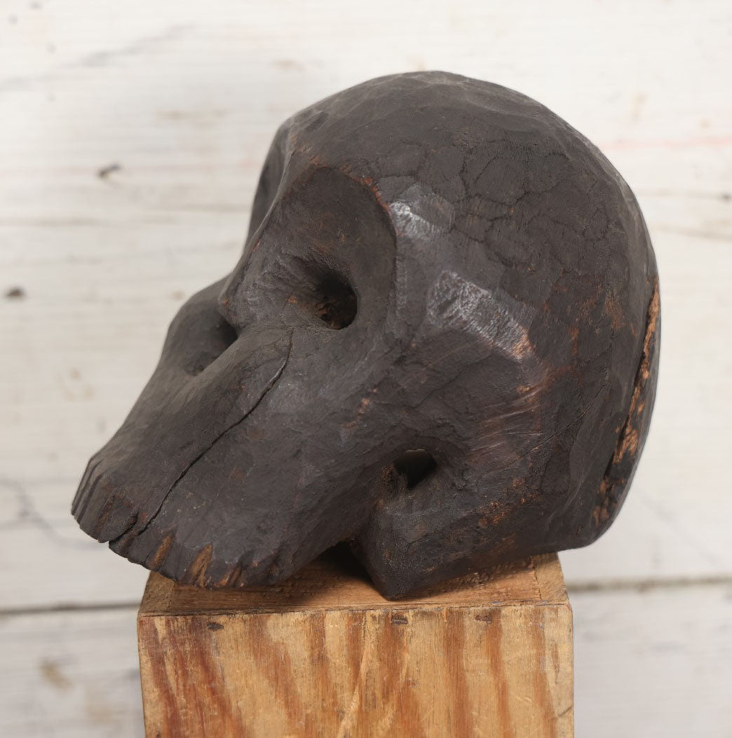 Lot 001 - Antique Folk Art Hand Carved Dark Wooden Skull, 4-1/2" x 6" x 5"