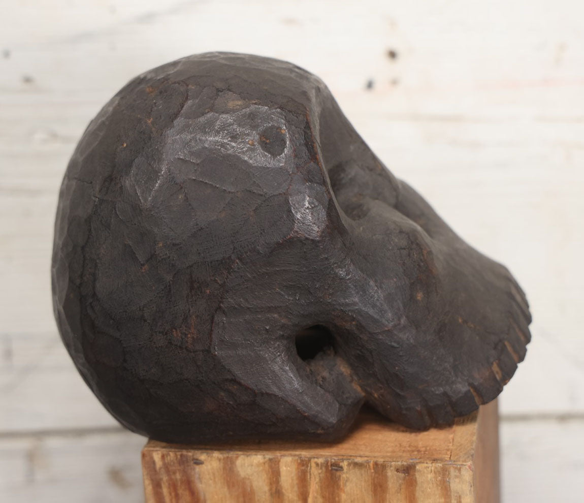 Lot 001 - Antique Folk Art Hand Carved Dark Wooden Skull, 4-1/2" x 6" x 5"