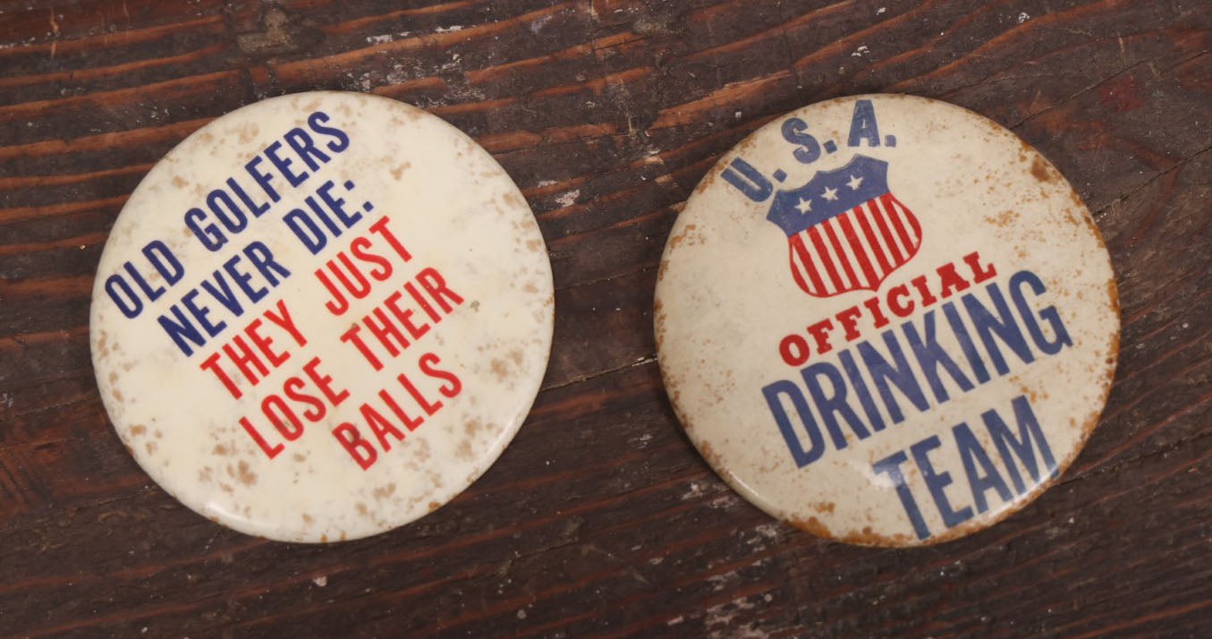 Lot 032 - Pair Of Vintage Novelty Pin Back Buttons, U.S.A. Official Drinking Team And Old Golfers Never Die