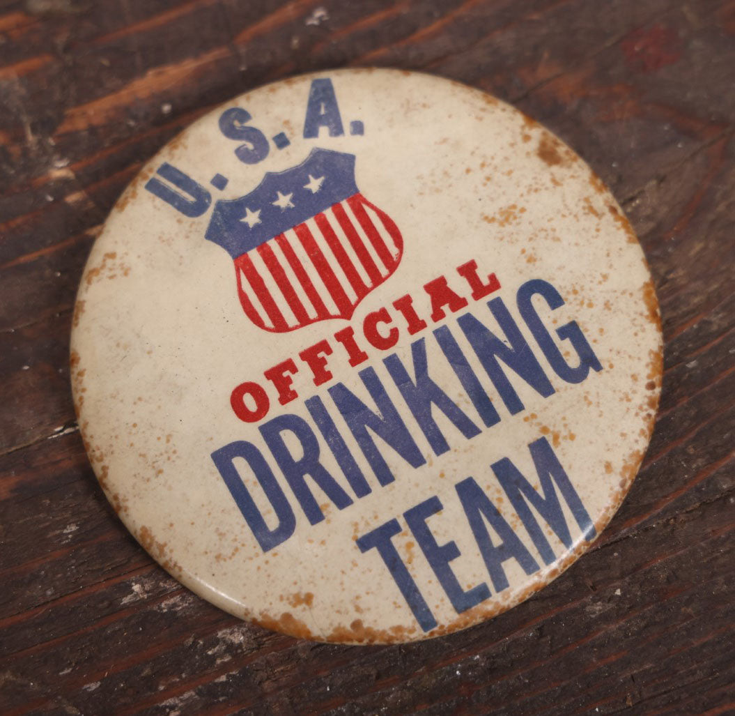 Lot 032 - Pair Of Vintage Novelty Pin Back Buttons, U.S.A. Official Drinking Team And Old Golfers Never Die