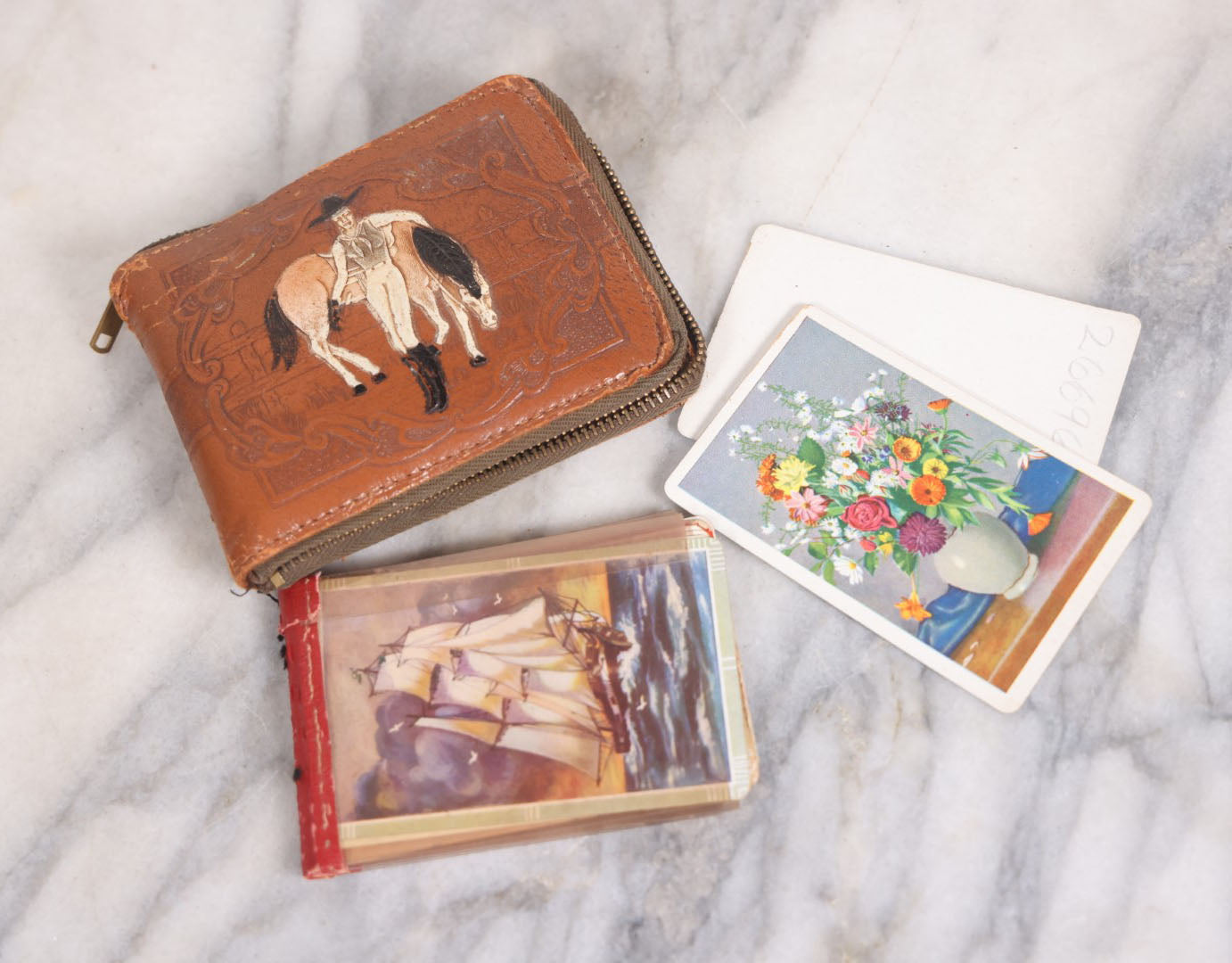 Lot 042 - Vintage Leather Painted Cowgirl Pinup Wallet With Horse, Holding Salesman's Sample Playing Card Blanks