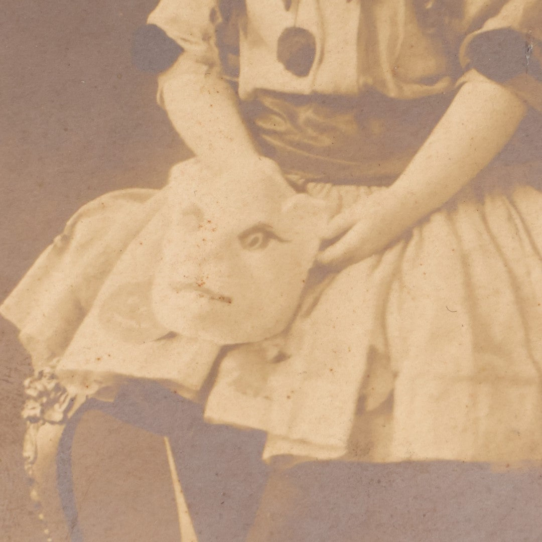 Lot 061 - Antique Photo Of A Young Girl In A Halloween Costume, Black Cats On Hat, Pumpkin Jack-O-Lanterns On Her Skirt, Holding An Animal Mask