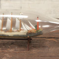 Lot 005 - Vintage Folk Art Ship In A Bottle, Handcrafted With Backdrop, Lighthouse, Ship Marked Boston, Bottle Signed New York, 1930