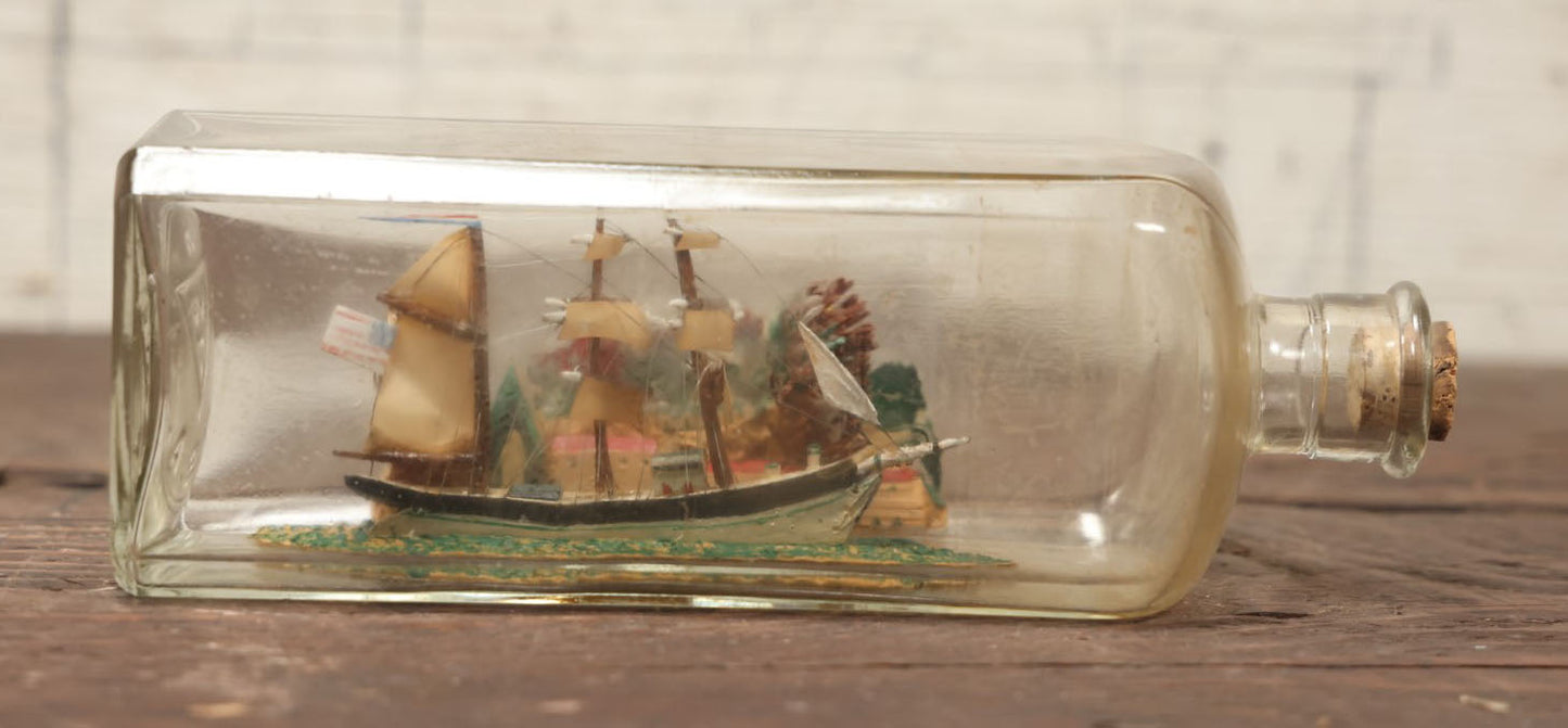 Lot 006 - Vintage Folk Art Ship In A Bottle, Handcrafted With Backdrop, Ship Has American Flag, Circa 1930